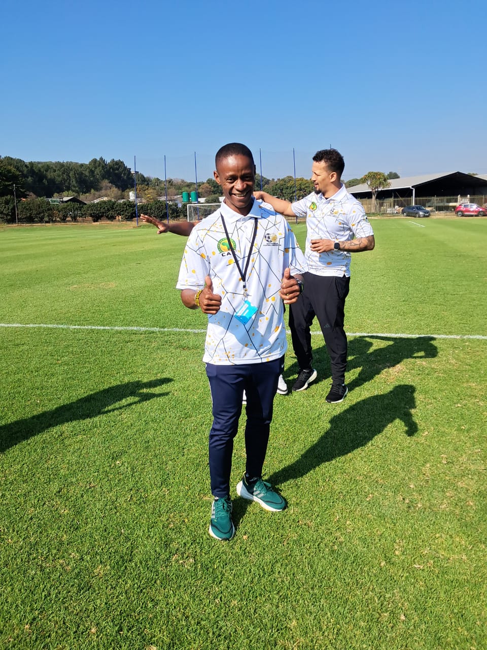 Coach Calvin Sosibo with players